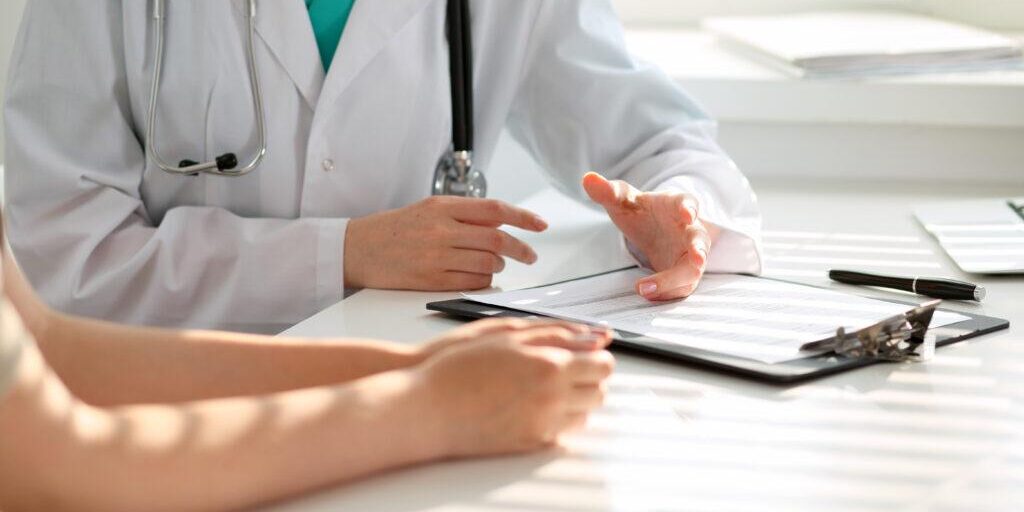 Doctor,And,Patient,Are,Discussing,Something,,Just,Hands,At,The